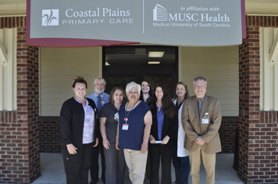 From left: Front Row - Danielle Lawson, Tori Carter, Tonya Faircloth, Dr. Melissa Bowers, Dr. Lee Butterfield Back Row - Dr. Malcolm Horry, Taylor Simmons and Suzanne Poole, NPPicture of Coastal Plains Primary Care Staff standing outside of building smiling. There is six females and two males.
Coastal Plains Primary Care at Hampton Regional Medical Center has received $20,000 as part of the 2022 Patient Centered Medical Home Recognition Excellence Award.